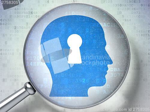 Image of Security concept:  Head With Keyhole with optical glass on digit