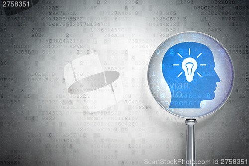 Image of Advertising concept:  Head With Light Bulb with optical glass on