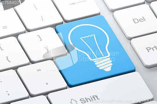 Image of Finance concept: Light Bulb on computer keyboard background