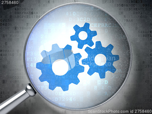 Image of Web design concept:  Gears with optical glass on digital backgro