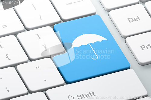 Image of Privacy concept: Umbrella on computer keyboard background