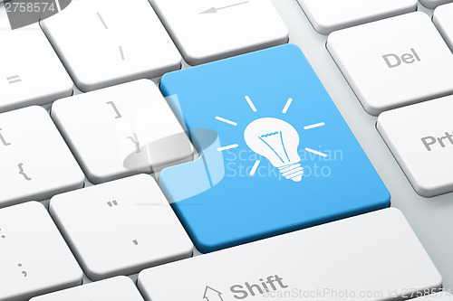 Image of Business concept: Light Bulb on computer keyboard background