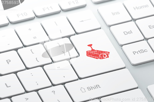 Image of Privacy concept: Cctv Camera on computer keyboard background