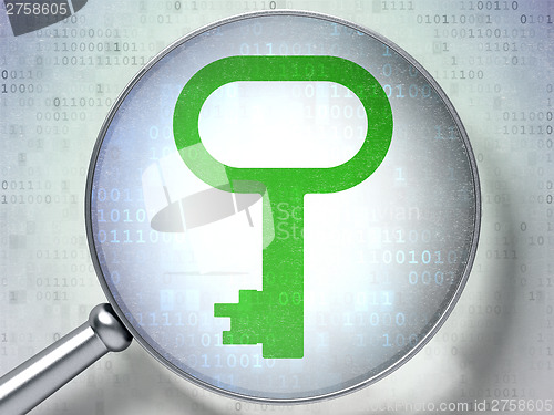 Image of Security concept:  Key with optical glass on digital background