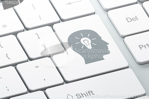 Image of Advertising concept: Head With Light Bulb on computer keyboard b