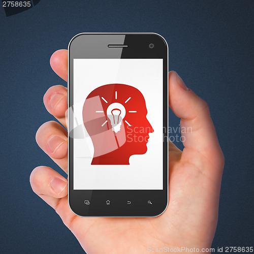 Image of Education concept: Head With Light Bulb on smartphone