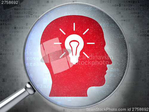 Image of Advertising concept:  Head With Light Bulb with optical glass on