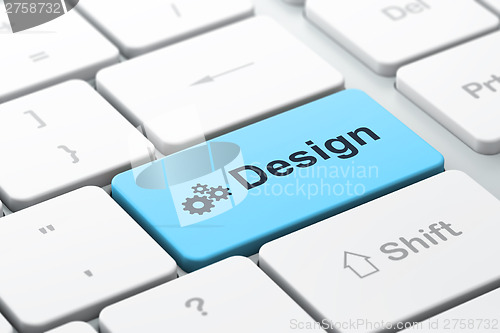 Image of Advertising concept: Gears and Design on computer keyboard backg