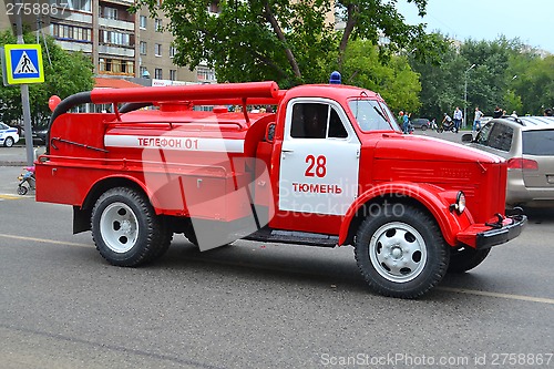 Image of The fire truck on the city street.