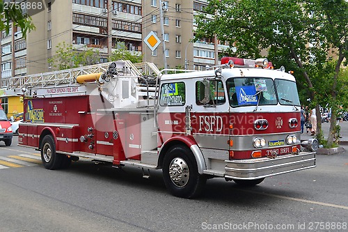 Image of The fire truck on the city street.