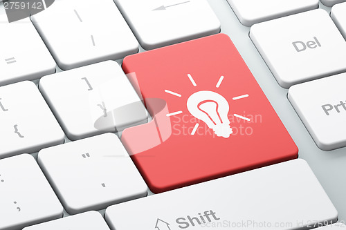 Image of Finance concept: Light Bulb on computer keyboard background