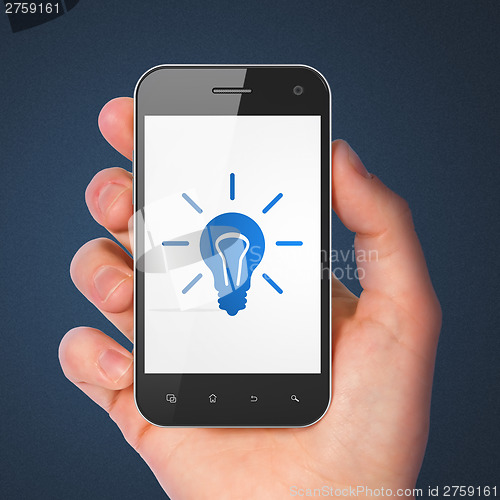 Image of Finance concept: Light Bulb on smartphone