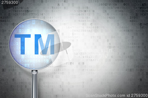 Image of Law concept:  Trademark with optical glass on digital background