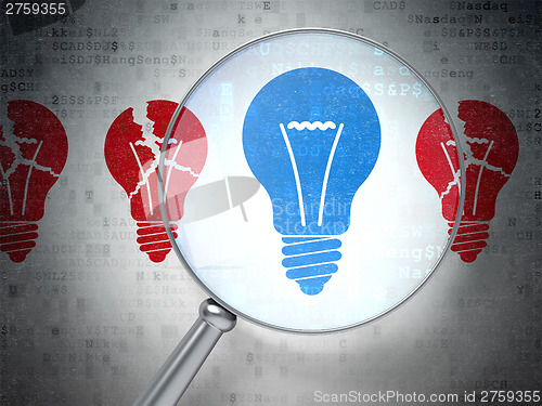Image of Finance concept: Lightbulb with optical glass on digital backgro