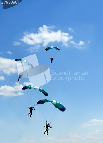 Image of unidentified skydiver on blue sky