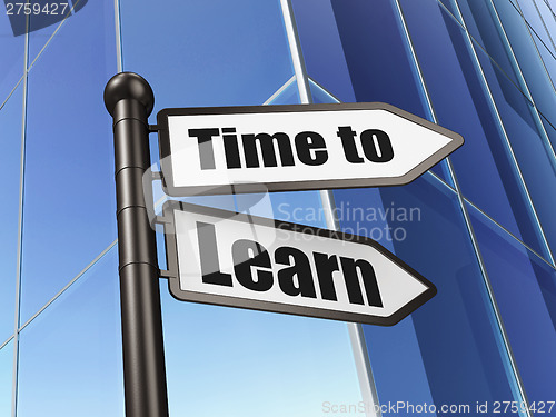 Image of Time concept: Time to Learn on Building background