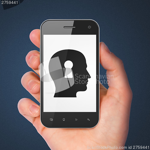 Image of Information concept: Head Whis Keyhole on smartphone