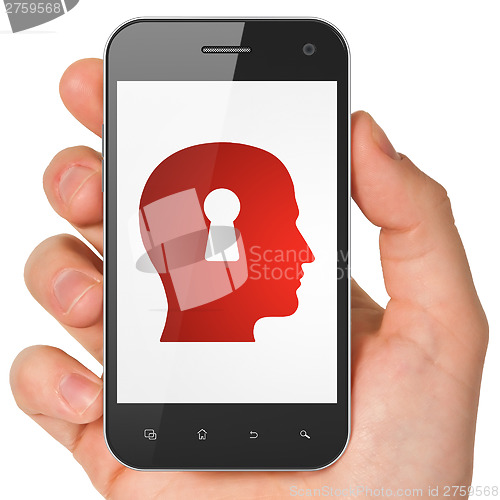 Image of Information concept: Head Whis Keyhole on smartphone