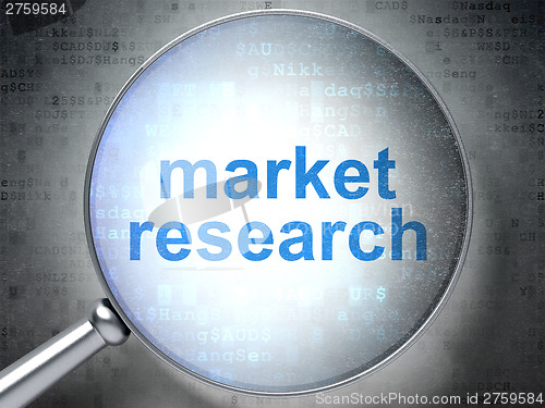 Image of Advertising concept: Market Research with optical glass on digit