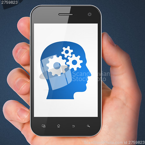 Image of Data concept: Head With Gears on smartphone