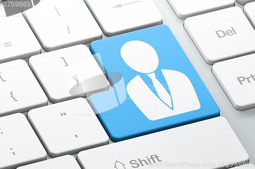 Image of Marketing concept: Business Man on computer keyboard background