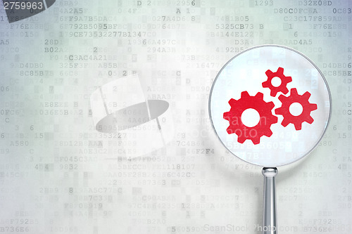 Image of Web development concept:  Gears with optical glass on digital ba