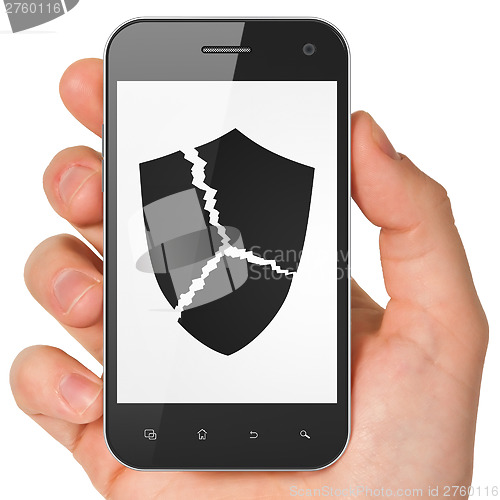 Image of Security concept: Broken Shield on smartphone
