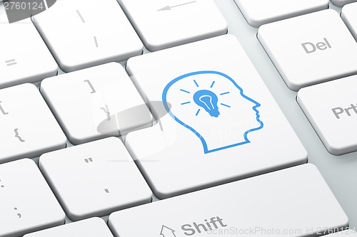 Image of Education concept: Head With Lightbulb on computer keyboard back