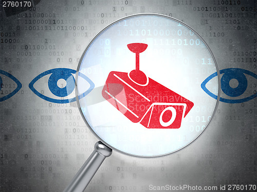 Image of Security concept: Camera And Eye with optical glass on digital b