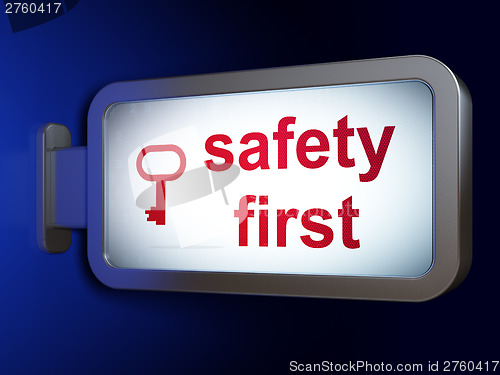 Image of Protection concept: Safety First and Key on billboard background