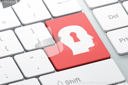 Image of Information concept: Head Whis Keyhole on computer keyboard back