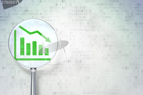 Image of Finance concept:  Decline Graph with optical glass on digital ba