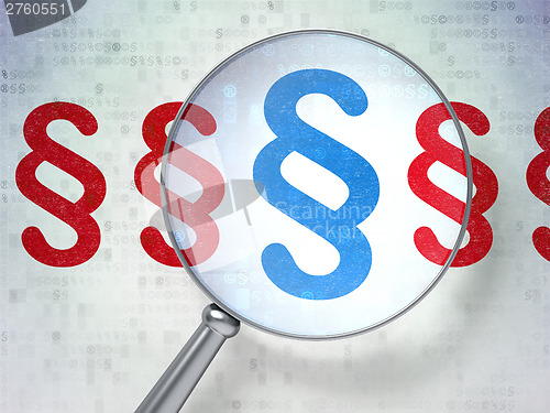 Image of Law concept: Paragraph with optical glass on digital background