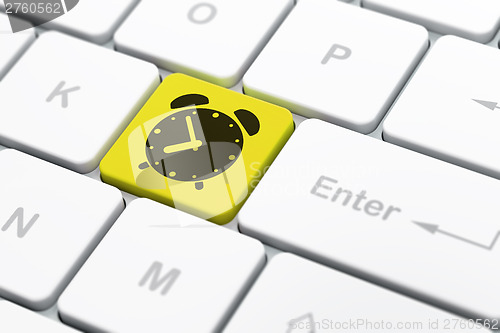 Image of Time concept: Alarm Clock on computer keyboard background