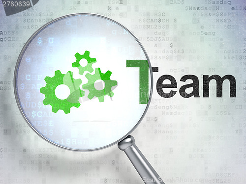 Image of Business concept: Gears and Team with optical glass on digital b