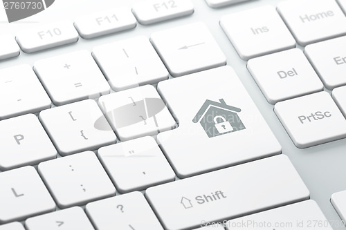 Image of Protection concept: Home on computer keyboard background