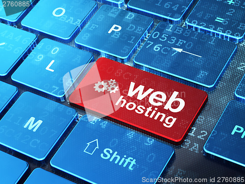 Image of Web design concept: Gears and Web Hosting on computer keyboard b