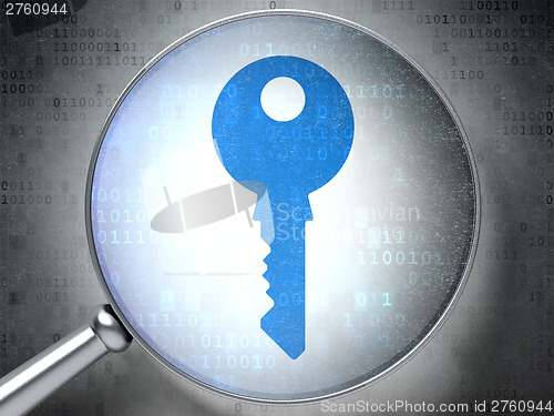 Image of Privacy concept:  Key with optical glass on digital background
