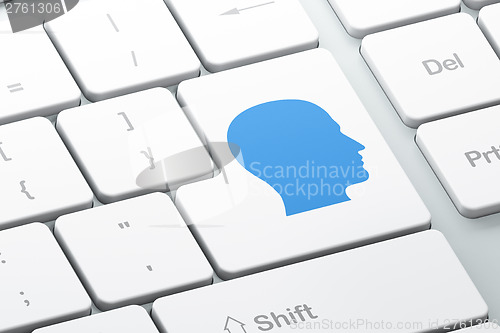 Image of Information concept: Head on computer keyboard