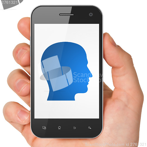 Image of Information concept: Head on smartphone