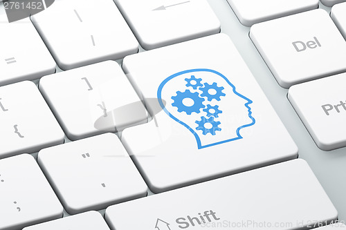 Image of Education concept: Head With Gears on computer keyboard