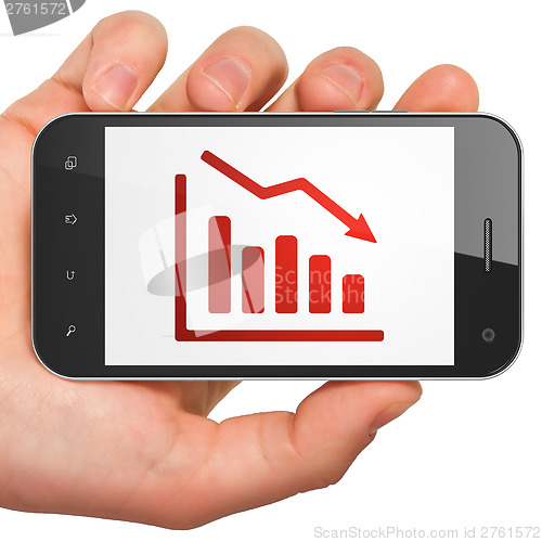 Image of Finance concept: Decline Graph on smartphone