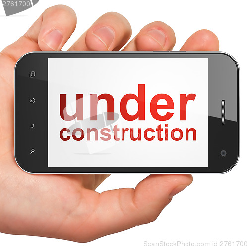 Image of Web design SEO concept: smartphone with Under Construction