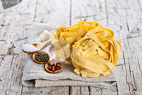 Image of raw egg pasta and spices 