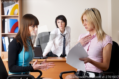 Image of Pretty businesswomen in office