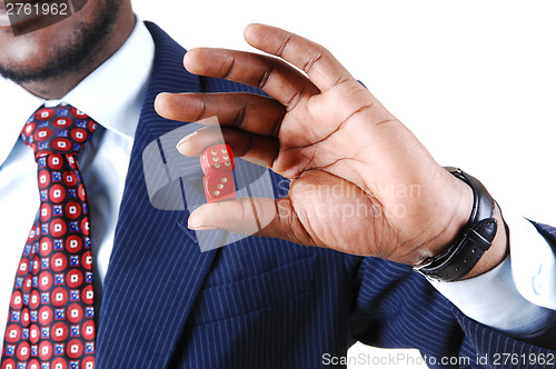 Image of Closeup of man holding dice.