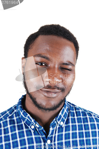 Image of Black man blinking with his eye.