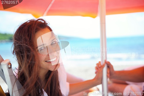 Image of happy couple have fun on the beach