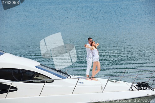 Image of young couple on yacht