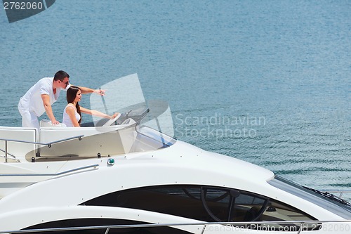 Image of young couple on yacht